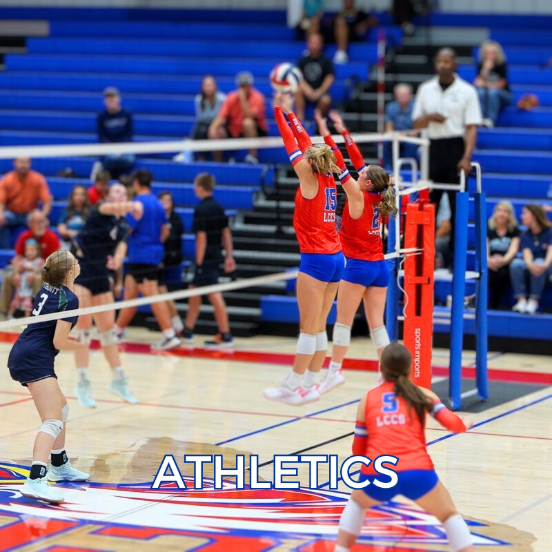 Photo of two basketball players as one shoots a baskets.